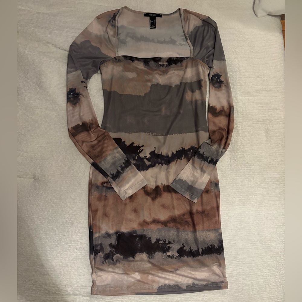 Brand new sheer, double lined mini dress